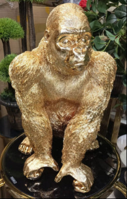 Golden Gorilla Sculpture on Glossy Pedestal