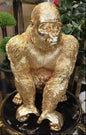Golden Gorilla Sculpture on Glossy Pedestal